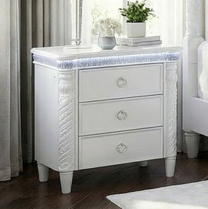 Octavia Victorian Style Pearl White Nightstand White nightstand with decorative carvings in a bedroom setting