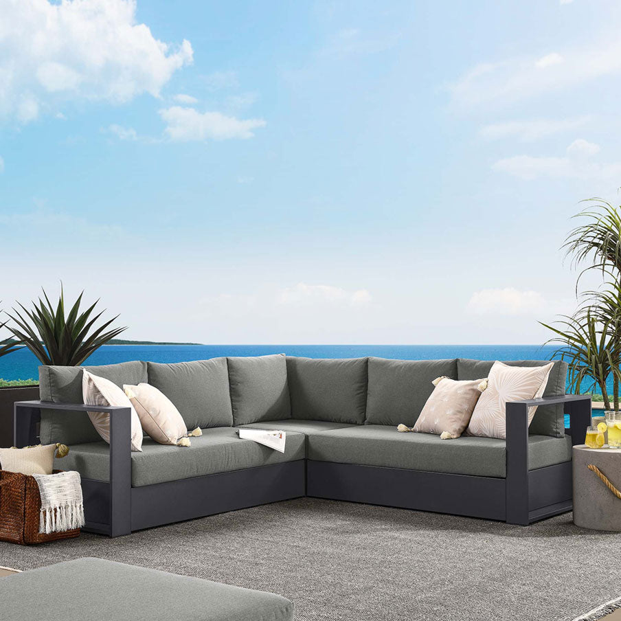 Gray Outdoor sectional sofa with cushions on a patio