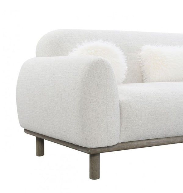 Owan Fabric Sofa With Pocket Coil Seating – Oat White textured sofa with wooden legs on a white background