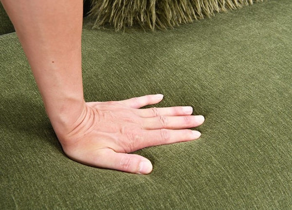 Owan Fabric Sofa With Pocket Coil Seating – Olive Green Hand on green textured fabric surface