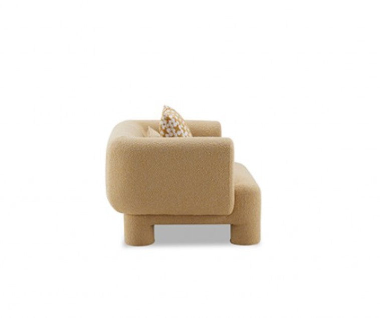 Phillip Modern Tight Seat Chair with Pillows Beige sofa with a patterned pillow in a room with a large window view of the ocean.