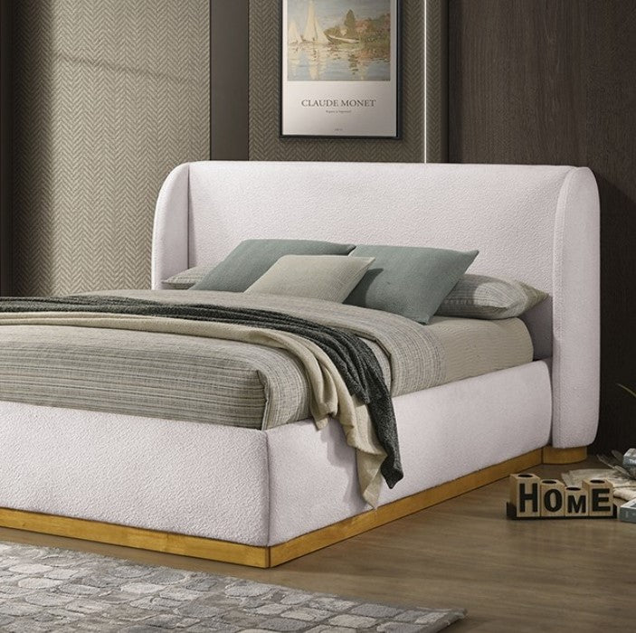 Pirewin Boucle Fully Upholstered Wingback Gold Plinth Base Bed White upholstered bed with wooden base in a room setting.