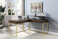 Primberg Walnut Two Tone Corner Desk An L-shaped corner desk with a dark brown wood-grain top and gold-finished metal legs, styled in a modern room with a laptop, lamp, and framed wall art.