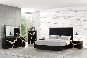 Primeberg Modern Black Pattern Bed Modern bedroom with black and gold furniture against a marble wall.