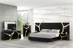 Primeberg Modern Black Gold Pattern Panel Bed Modern bedroom set with black and gold marble-patterned furniture against a marble wall.