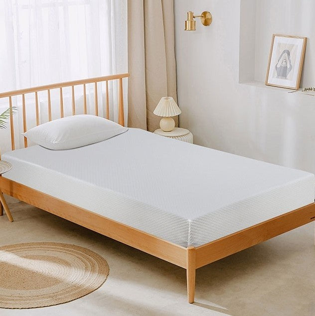 Primenite Memory Foam Mattress 12" A children's single bed styled in a pink and white bedroom, featuring a Minnie Mouse-inspired headboard with pink bow details, a white mattress, and a matching pink pillow. The room includes a pink dresser, a pink stool, and a window with sheer curtains.