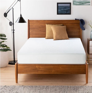 Primenite Memory Foam Mattress 12" A modern wooden bed frame with a white mattress and two tan pillows, styled in a bedroom setting with a black floor lamp, wooden floor, and framed wall art.