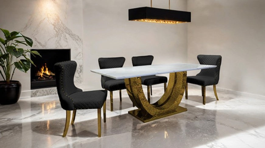 Primenova Upholstered Gold Black Dining Chair Black quilted chair with gold legs on a white floor and background