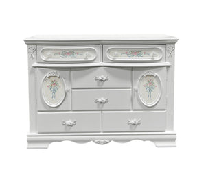 Primrose White Dresser with Floral Accent A white French-style dresser with ornate floral details and silver drawer pulls, isolated on a white background.