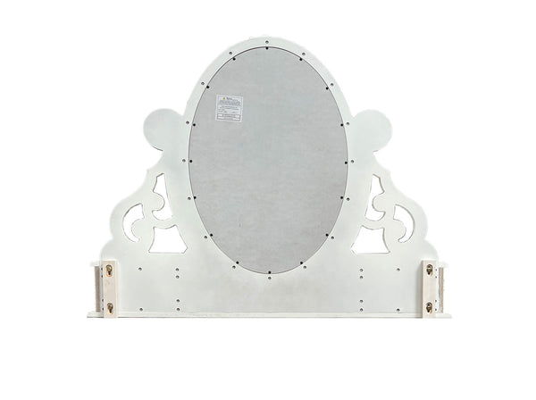 Primrose White Mirror with Floral Accent A white decorative wall mirror with an oval reflective center and ornate scrollwork sides, shown against a plain white background.