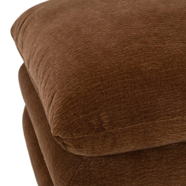 Prinkett Modular Corner Brown Fabric Ottoman Close-up of a brown textured fabric cushion or upholstered furniture surface on a white background.