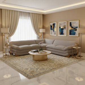 Prinkett Modular Corner Light Gray Sectional Sofa A light gray upholstered sectional sofa with a low-profile, rounded design and natural wood legs, shown from a three-quarters angle on a white background.