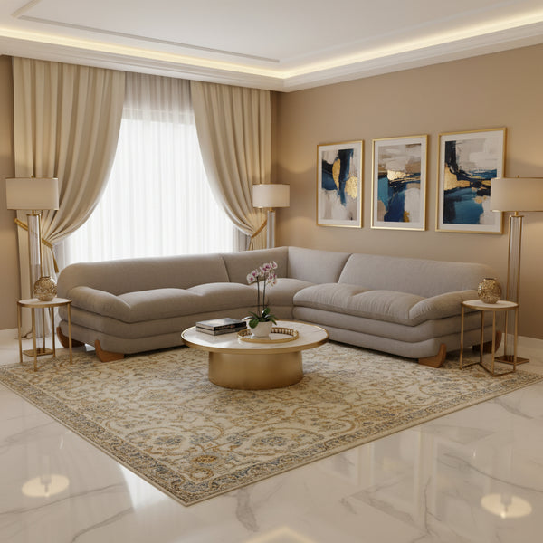 Prinkett Modular Corner Light Gray Sectional Sofa A light gray upholstered sectional sofa with a low-profile, rounded design and natural wood legs, shown from a three-quarters angle on a white background.