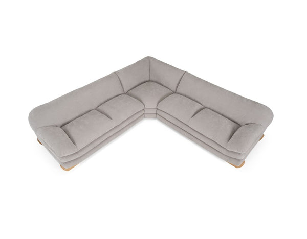 Prinkett Modular Corner Light Gray Sectional Sofa A light gray L-shaped sectional sofa with a plush, textured fabric and light wood legs, shown from a high-angle perspective on a solid white background.