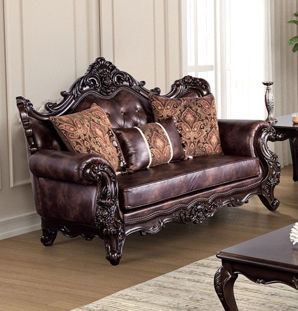 Prisya Traditional Leatherette Rolled Arm Loveseat Decorative brown leather sofa with intricate carvings in a living room setting.