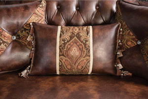 Prisya Traditional Leatherette Rolled Arm Sofa Decorative brown pillow with intricate patterns on a matching brown sofa.