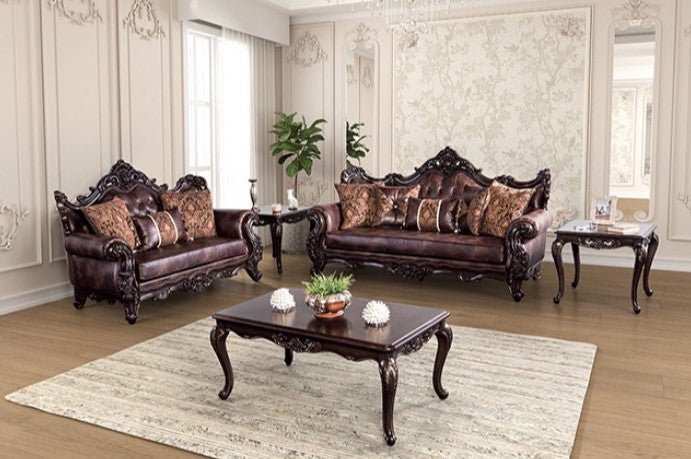 Prisya Traditional Leatherette Rolled Arm Chair Decorative brown leather sofa with intricate carvings in a room.