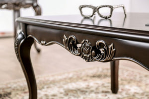DPrisya Traditional Solid Wood Coffee Table ecorative table with intricate carvings and a pair of glasses on top.