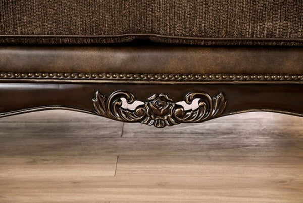 Priya Leatherette Fabric Button Tufted Sofa Close-up of a decorative armchair with intricate carvings on a wooden floor.