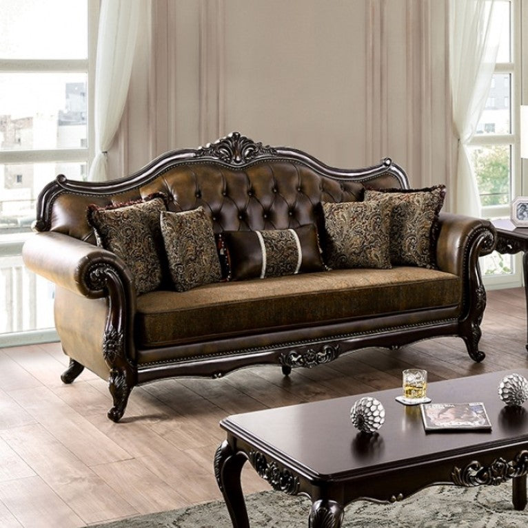 Priya Leatherette Fabric Button Tufted Sofa Luxurious brown leather sofa with decorative pillows in a living room setting.