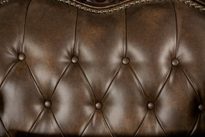 Priya Leatherette Fabric Button Tufted Sofa Close-up of a brown leather sofa with tufted backrest