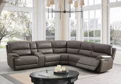 Punge Power Motion Reclining Sectional Sofa Gray sectional sofa in a living room with large windows.