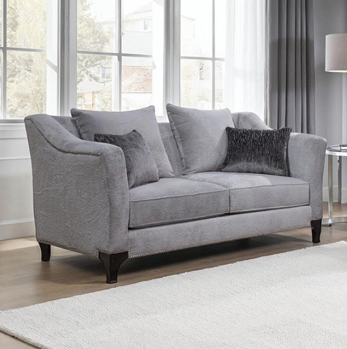 Risha Sloped Arm Light Gray Loveseat Gray sofa with dark cushions in a living room setting