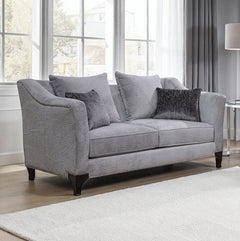 Risha Sloped Arm Light Gray Loveseat Gray sofa with dark cushions in a living room setting