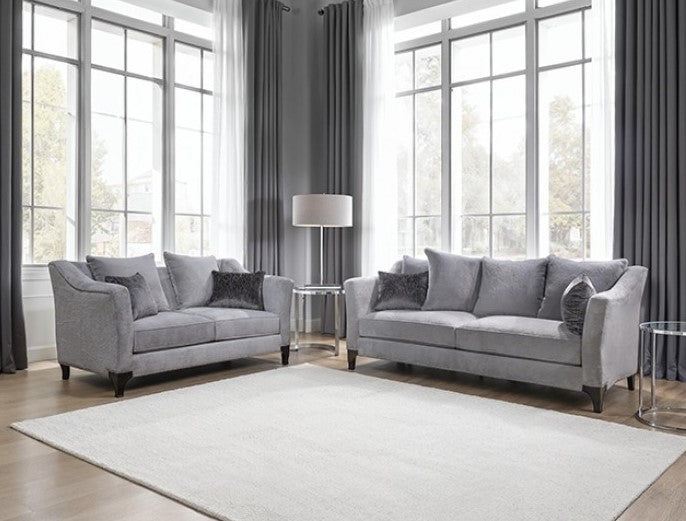 Risha Sloped Arm Light Gray Loveseat Gray sofa with dark cushions in a living room setting