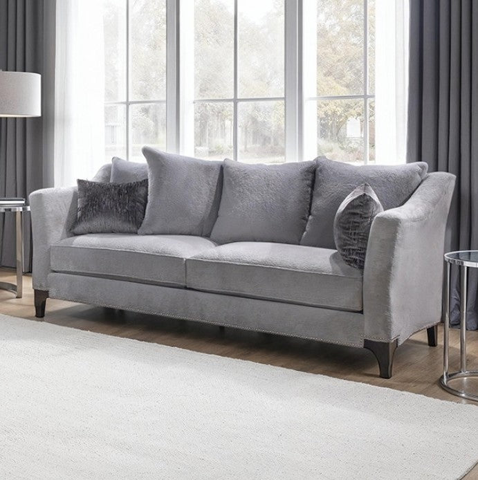 Risha Sloped Arm Light Gray Sofa Gray sofa with decorative pillows in a living room setting