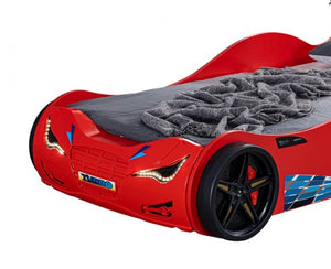 Ronny High Gloss Race Car Bed Red car-shaped bed with gray mattress on a white background