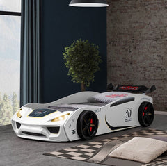 Rotvner Race Car-Bed With LED Headlights Children's car-shaped bed in a room with a window and plant