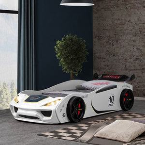 Rotvner Race Car-Bed With LED Headlights Children's car-shaped bed in a room with a window and plant