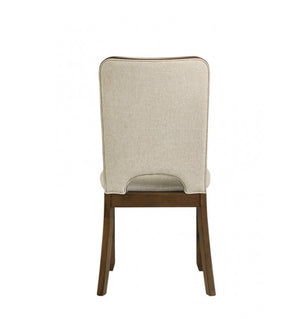 Saharia Mid-Century Modern Walnut Dining Chair A dining chair shown from the back, featuring a tall, high-back upholstered backrest and seat in a light beige textured fabric, supported by a dark brown wooden frame.
