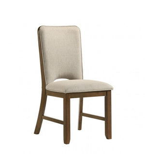 Saharia Mid-Century Modern Walnut Dining Chair An upholstered dining chair with a tall backrest, featuring light beige textured fabric on the seat and back, supported by a medium brown wooden frame, shown against a plain white background.