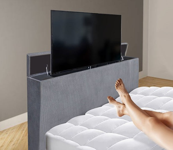 Samberg Modern  Fireplace Simulator Gray Bed With TV Lift TV mounted on a headboard with a person lying on a bed below