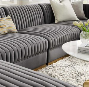 Sanchi 6PC Channel Tufted Velvet Modular Sectional Sofa Gray Gray sectional sofa with decorative pillows in a living room setting.