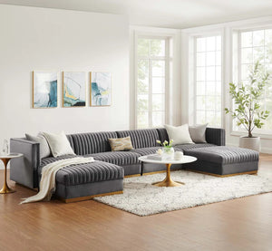 Sanchi 6PC Channel Tufted Velvet Modular Sectional Sofa Gray Modern living room with a gray sectional sofa, coffee table, and abstract art on the wall.