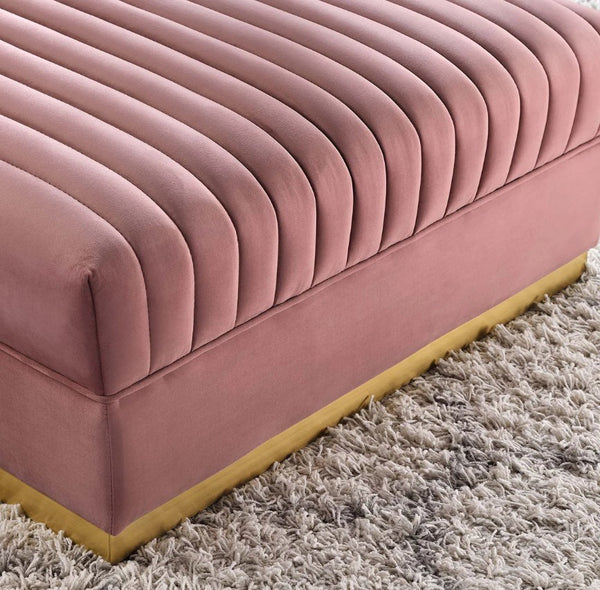 Sanchi Channel Tufted Velvet Modular Sectional Sofa Ottoman Pink velvet sofa with a textured surface on a beige carpet