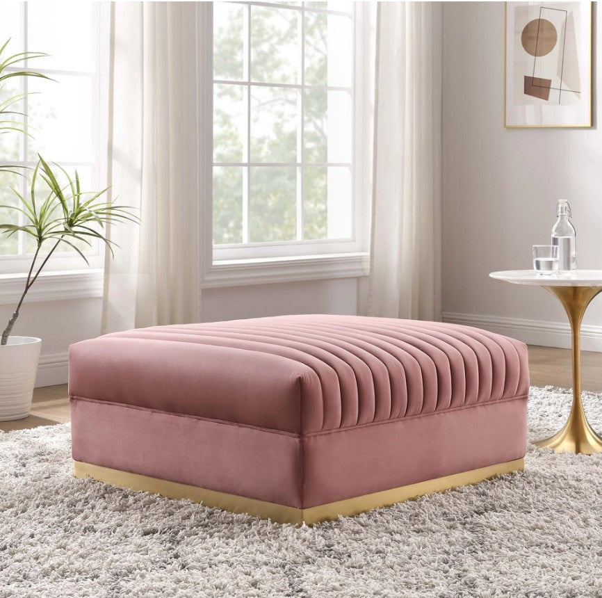 Sanchi Channel Tufted Velvet Modular Sectional Sofa Ottoman Pink ottoman in a room with a window, plant, and side table.