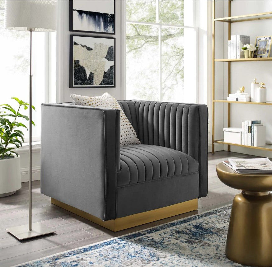 Sanchi Vertical Channel Tufted Velvet Chair Gray Gray armchair in a modern living room with a lamp, plant, and bookshelf.