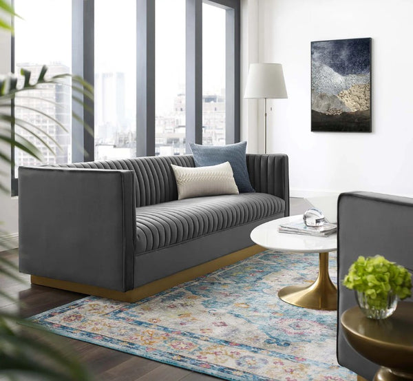 Sanchi Vertical Channel Tufted Velvet Sofa Gray Modern living room with a gray sofa, round coffee table, and decorative elements.