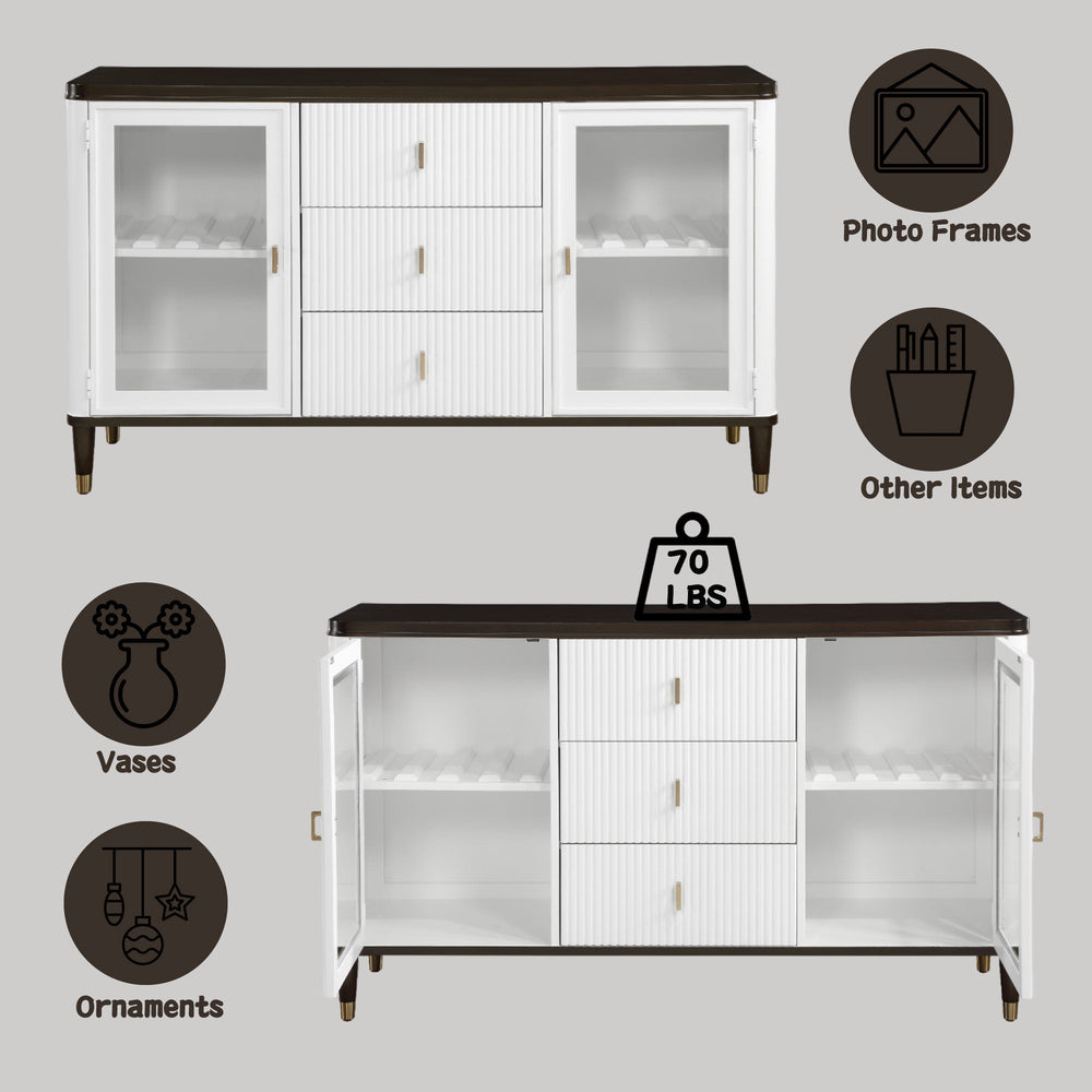 Serania Two Tone Dining Server A modern white sideboard cabinet with a dark brown top, glass-front doors on both sides, and three ribbed center drawers with small gold handles, shown against a light gray wall and wood floor.