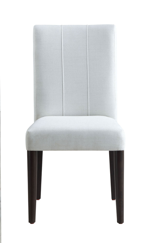 Serania Two Tone Dining Table Chair An upholstered dining chair with a tall, vertically channel-tufted backrest and a padded seat, upholstered in a light gray fabric with dark brown wooden legs, shown against a plain white background.