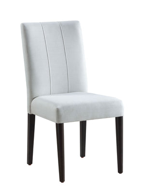 Serania Two Tone Dining Table Chair White upholstered chair with dark wood legs on a white background