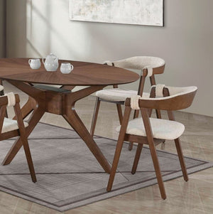 Serika Mid Century Modern Oval Walnut Dining Table A mid-century modern dining set featuring a round wooden table and four matching armchairs with cream bouclé seats and backs, arranged on a gray patterned rug in a bright dining room.