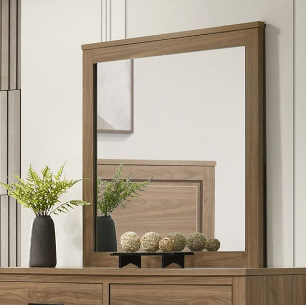 Serranto Walnut Finish Mirror Wooden mirror on a dresser with decorative items and plants.