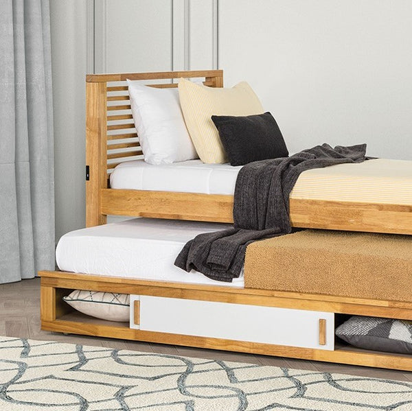 Sherman Storage Bed Slat Design Light Oak Wooden bed with white bedding and pillows in a bedroom setting