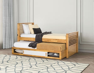 Sherman Storage Bed Slat Design Light Oak Wooden bed with pull-out trundle in a room with curtains and a rug.