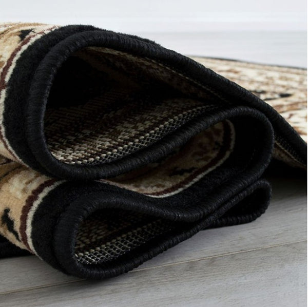 Shotta Traditional Style 5x8 Brown Area Rug Folded rug with geometric pattern on a light wooden floor